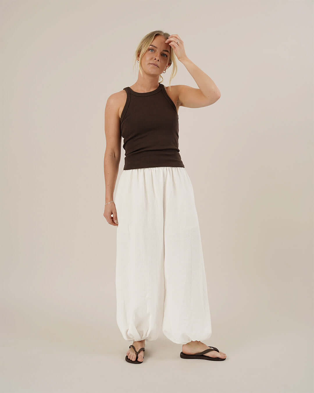 Model wearing Bubble Pants sewing pattern with voluminous legs and elastic waistband.