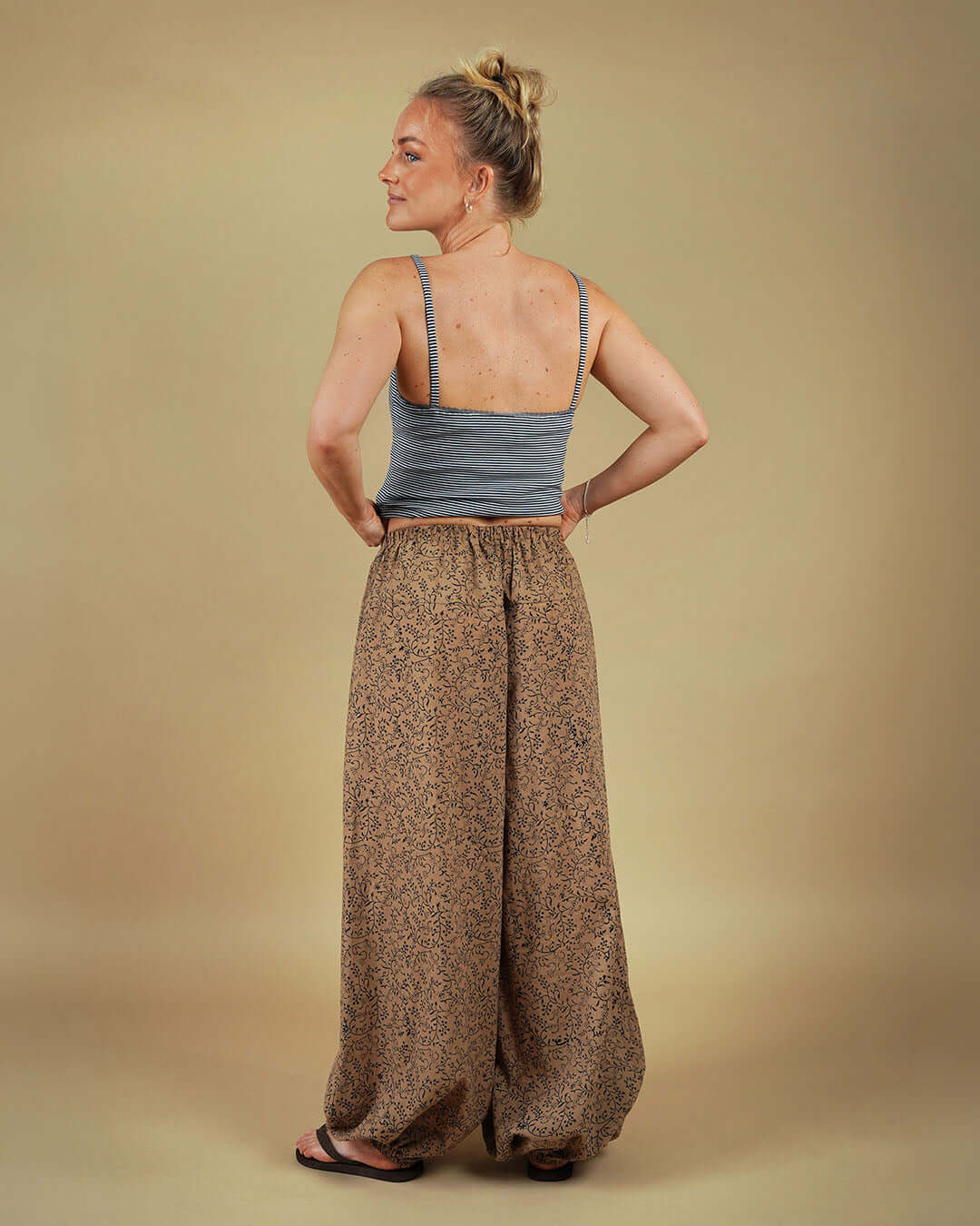 Model wearing Bubble Pants sewing pattern with voluminous legs from the back view, showcasing playful silhouette.