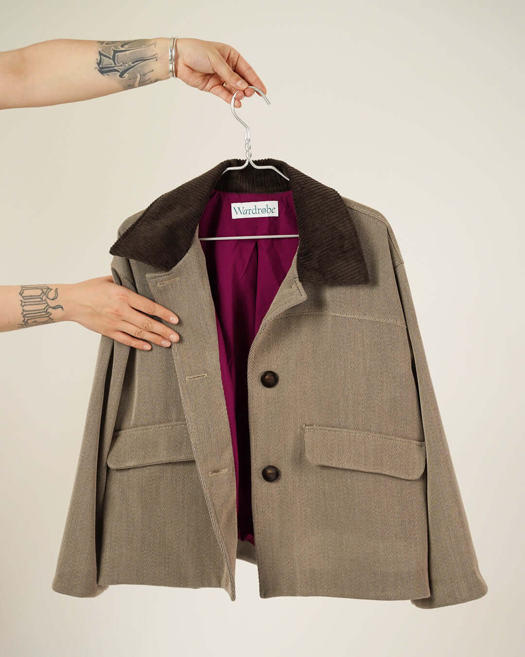Car Coat Sewing Pattern showcased, featuring a stylish gray coat with a brown collar and vibrant interior.