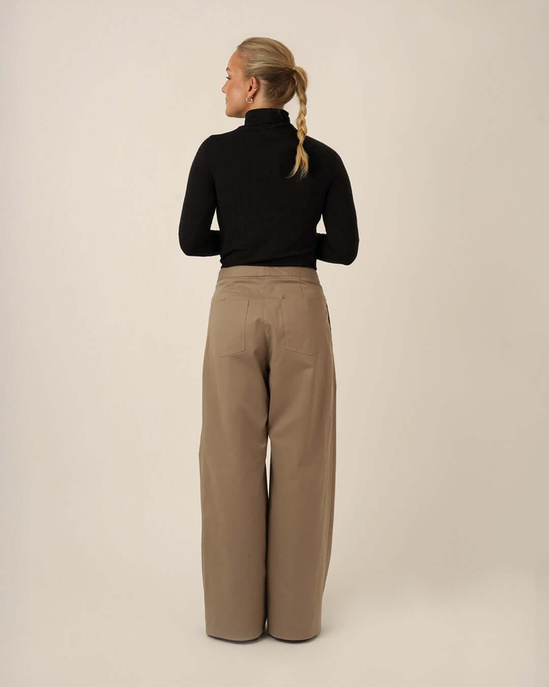 Bermuda Pants and Shorts Sewing Pattern displayed on a model from the back, showcasing a relaxed fit and deep side pockets.