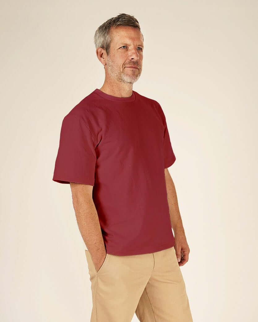 Man wearing a red Big T-shirt sewing pattern and Chino pants sewing pattern