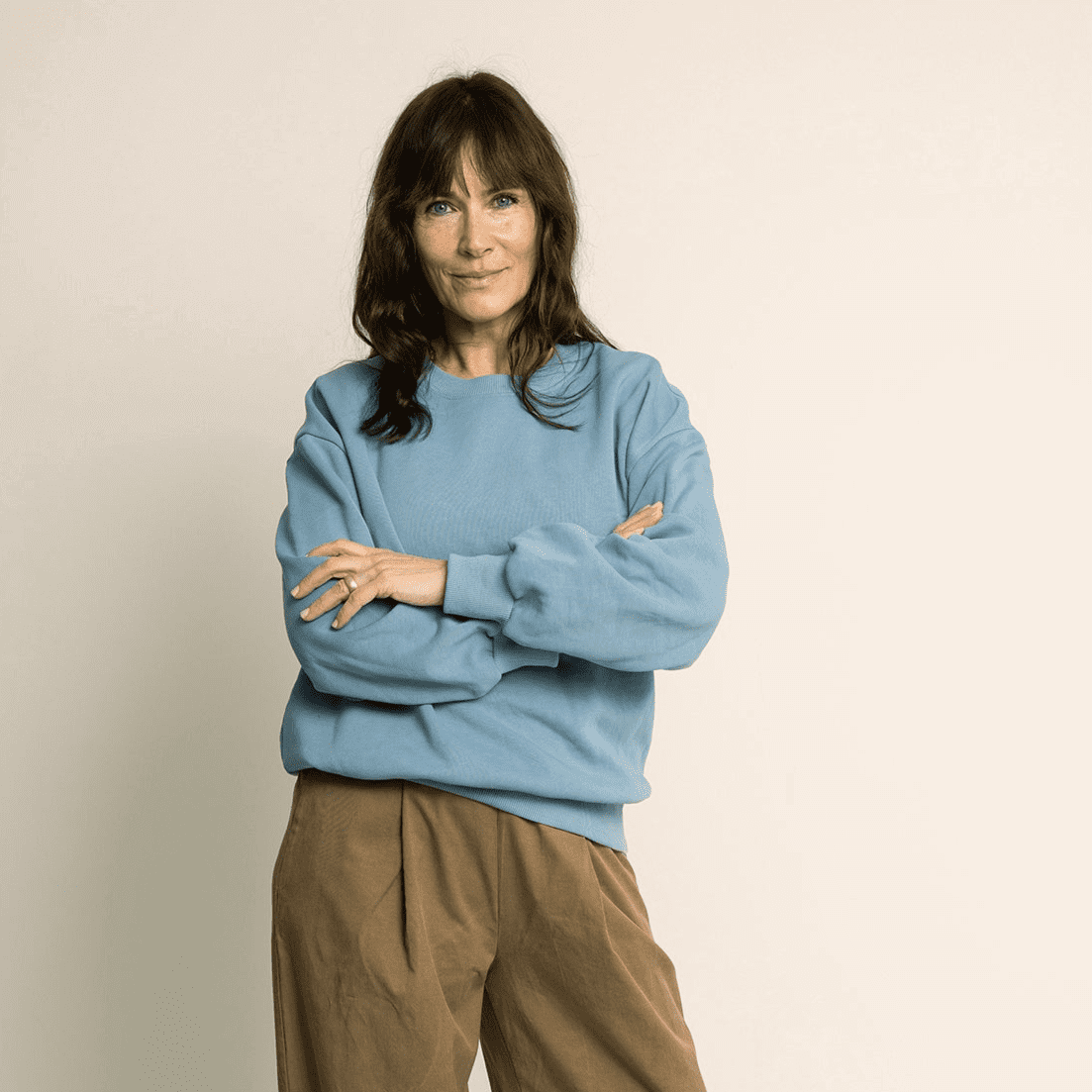 Model wearing a blue oversized sweater showcasing the Boyfriend Sweater Paper Pattern in a cozy and stylish look.