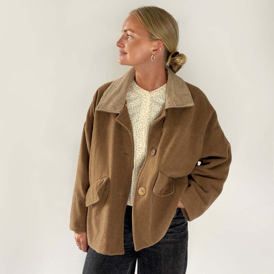 Car Coat Sewing Pattern model wearing a brown relaxed coat with corduroy collar and casual outfit.