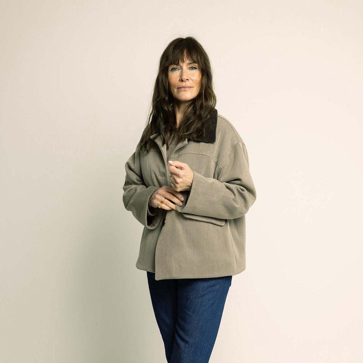 Woman wearing a stylish relaxed Car Coat Sewing Pattern in a neutral tone.