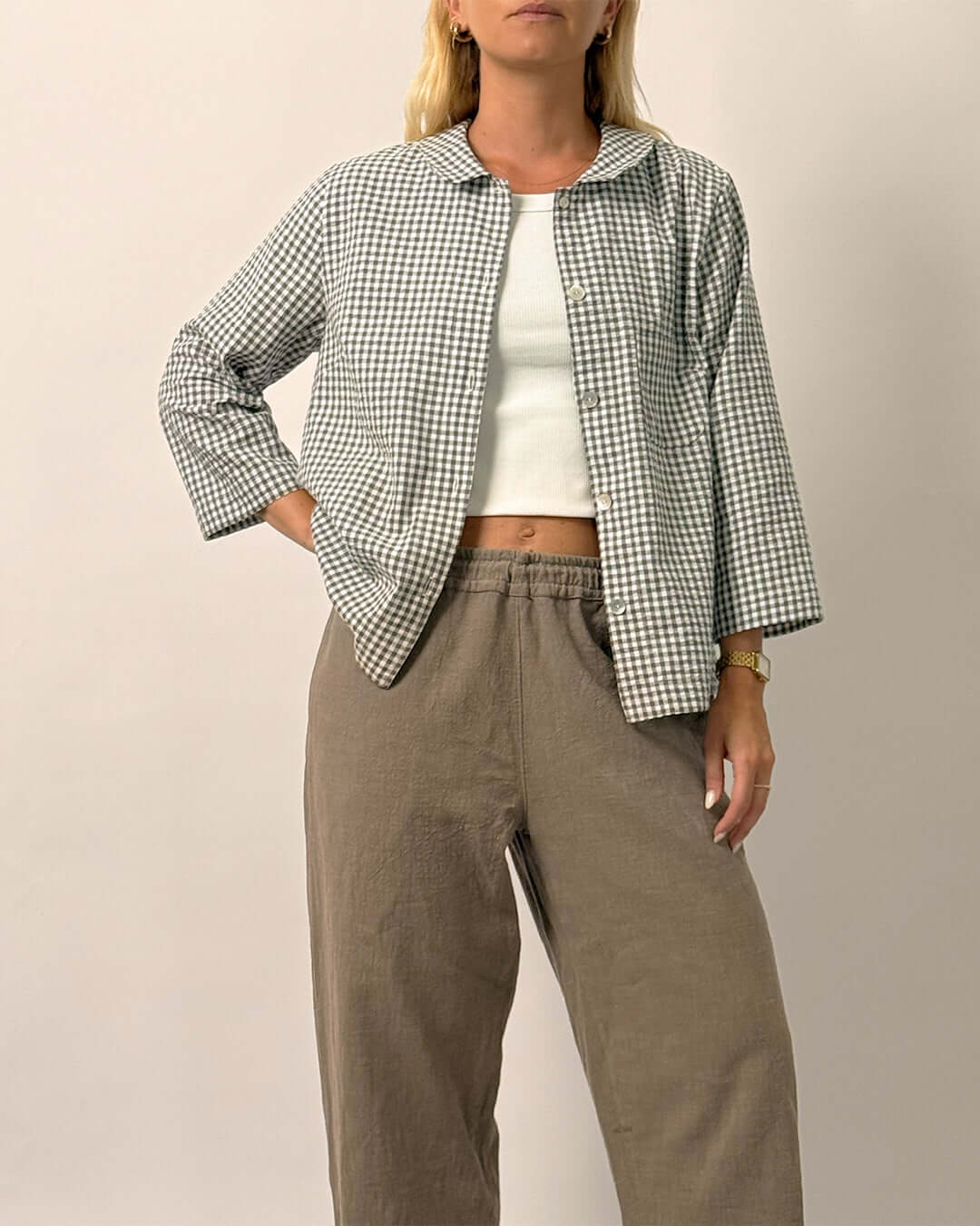 Dukke Blouse sewing pattern worn by a model, featuring a relaxed-fit button-up shirt with a Peter Pan collar.