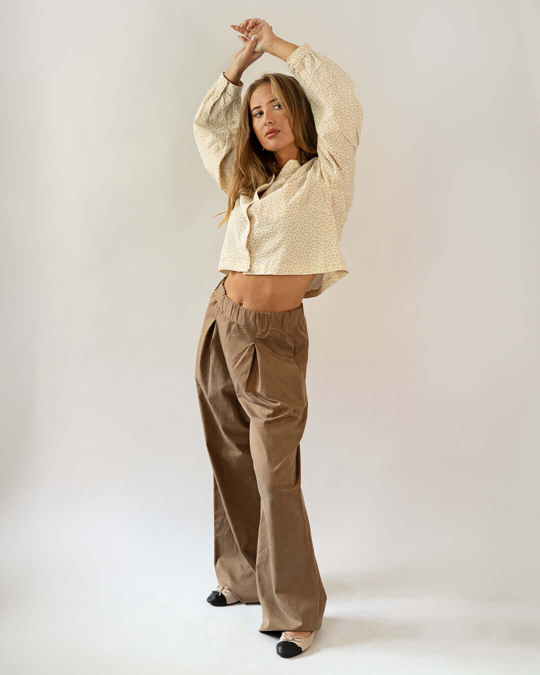 Model wearing Palazzo Pants Paper Pattern showcasing wide legs and elastic waistline.