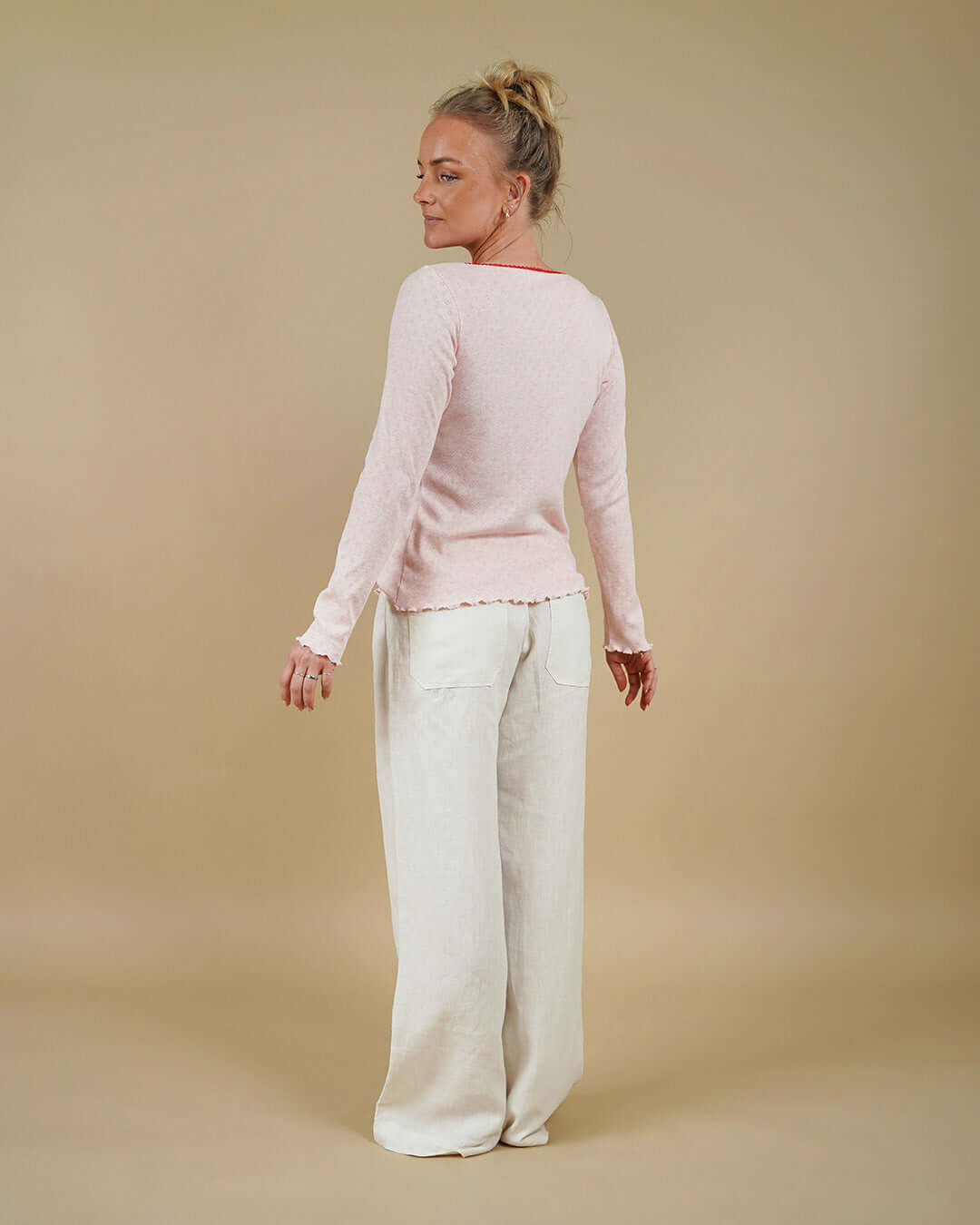 Woman wearing the Camisole Top and High Waist Pants sewing pattern, back three-quarter view