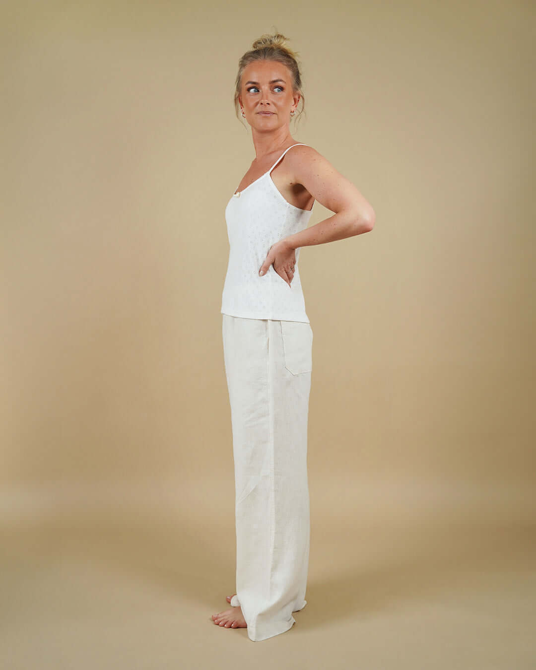 Woman wearing the Camisole Top and High Waist Pants sewing pattern, side view