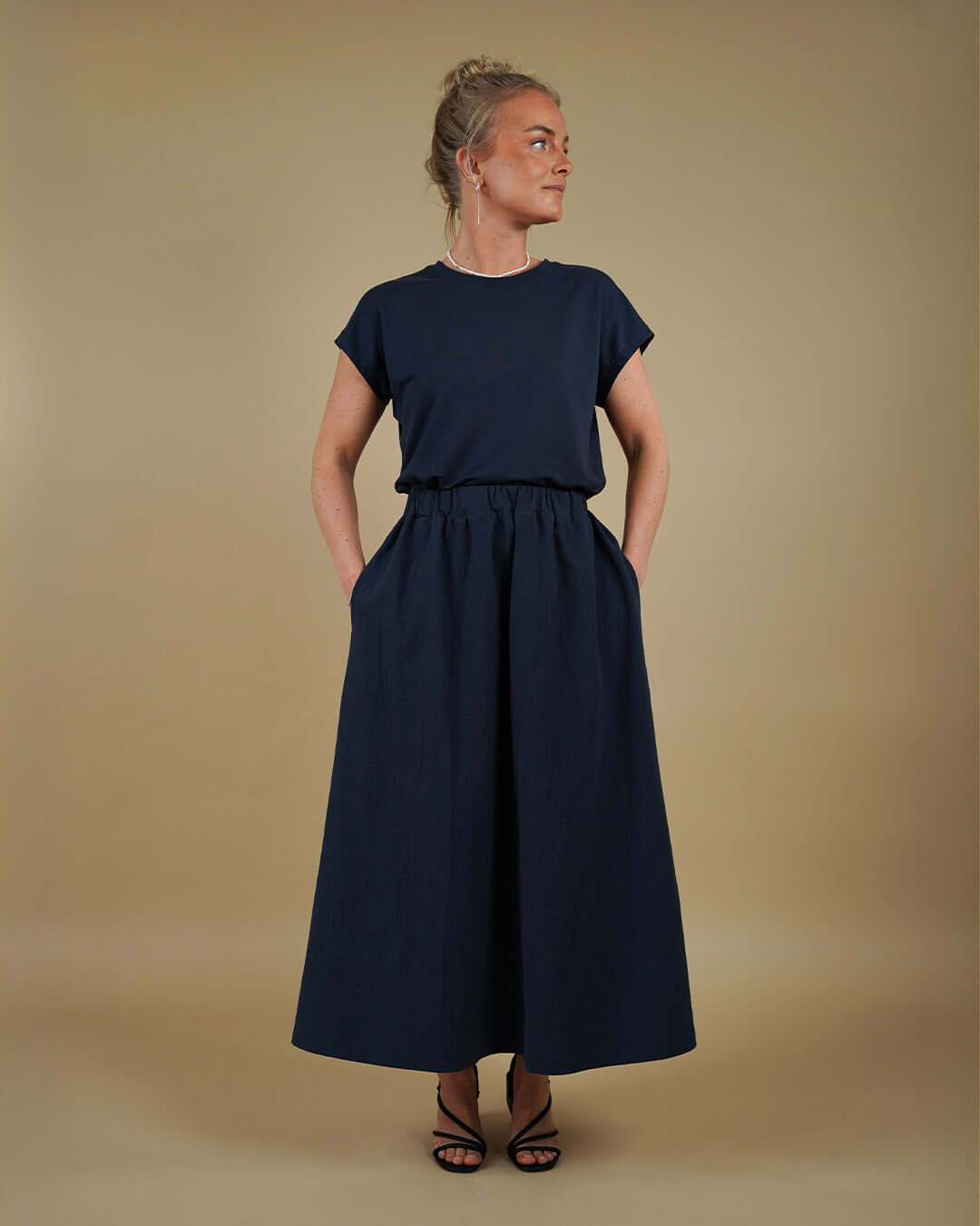 Woman wearing the Easy Tee and Claude Skirt sewing pattern, front view