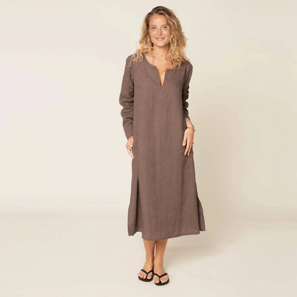 Piper Tunic Paper Pattern women's sizes model wearing a long brown tunic dress with a relaxed fit and stylish details.