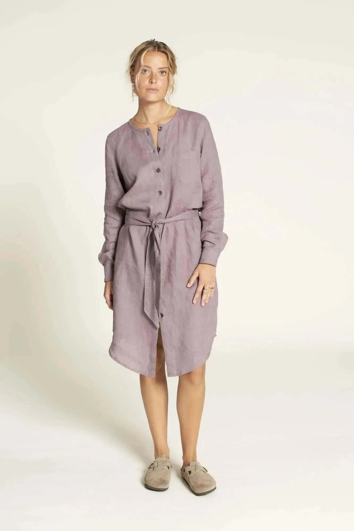 Savannah shirt Paper Pattern worn by a model in a lilac long-sleeve dress with a tie, showcasing its versatility.