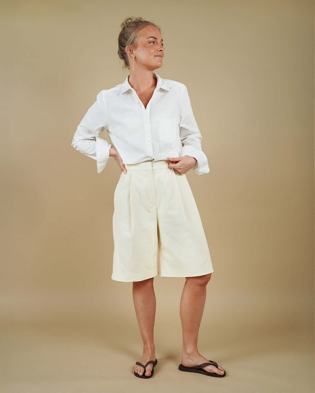 Model wearing the Anna Shirt sewing pattern with a crisp collar and relaxed fit shorts.