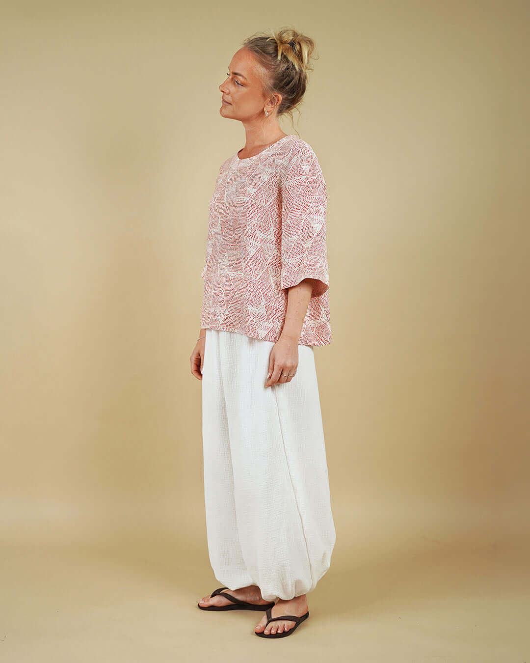Woman wearing the Silke Blouse and Bubble Pants sewing pattern, side view