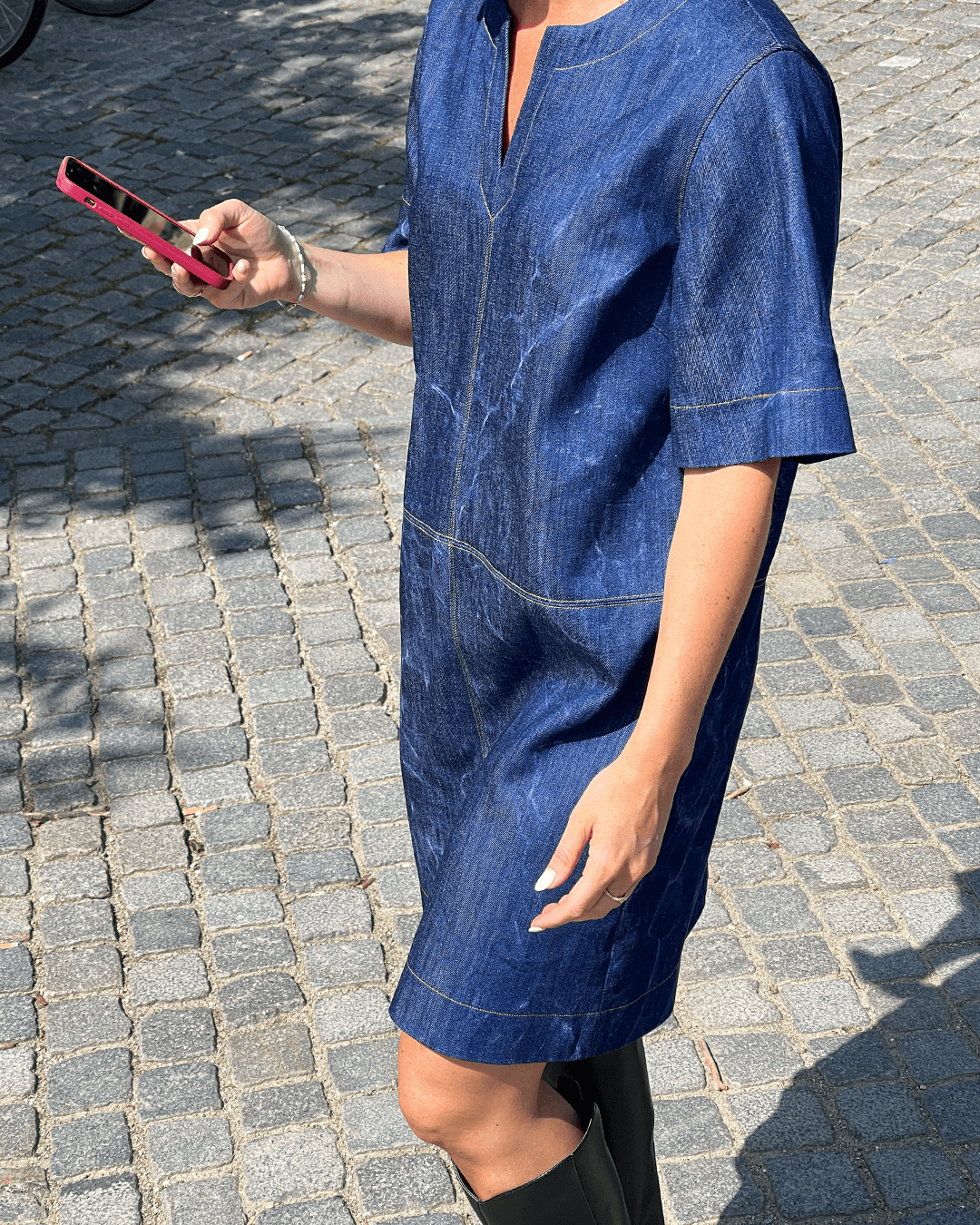 City Dress Sewing Pattern styled in denim with short sleeves and a V-neck, perfect for casual outings.