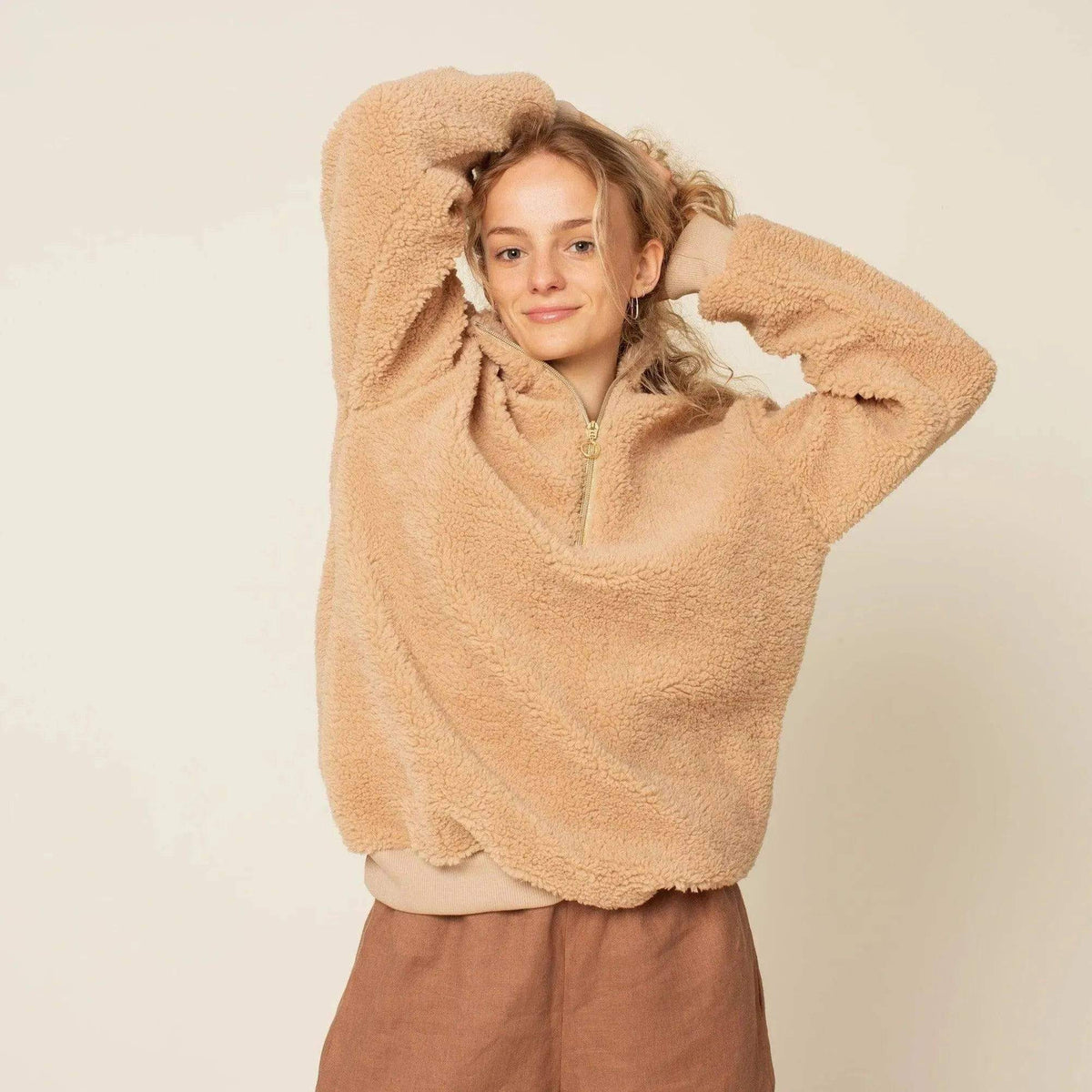 Model wearing a cozy Half-Zipper Sweater Paper Pattern with a relaxed fit and half-zip collar.