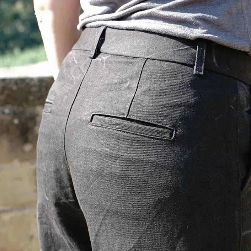 Hepburn Pants Paper Pattern showcasing fitted back with welt pockets and contoured waistband for women's sizes.