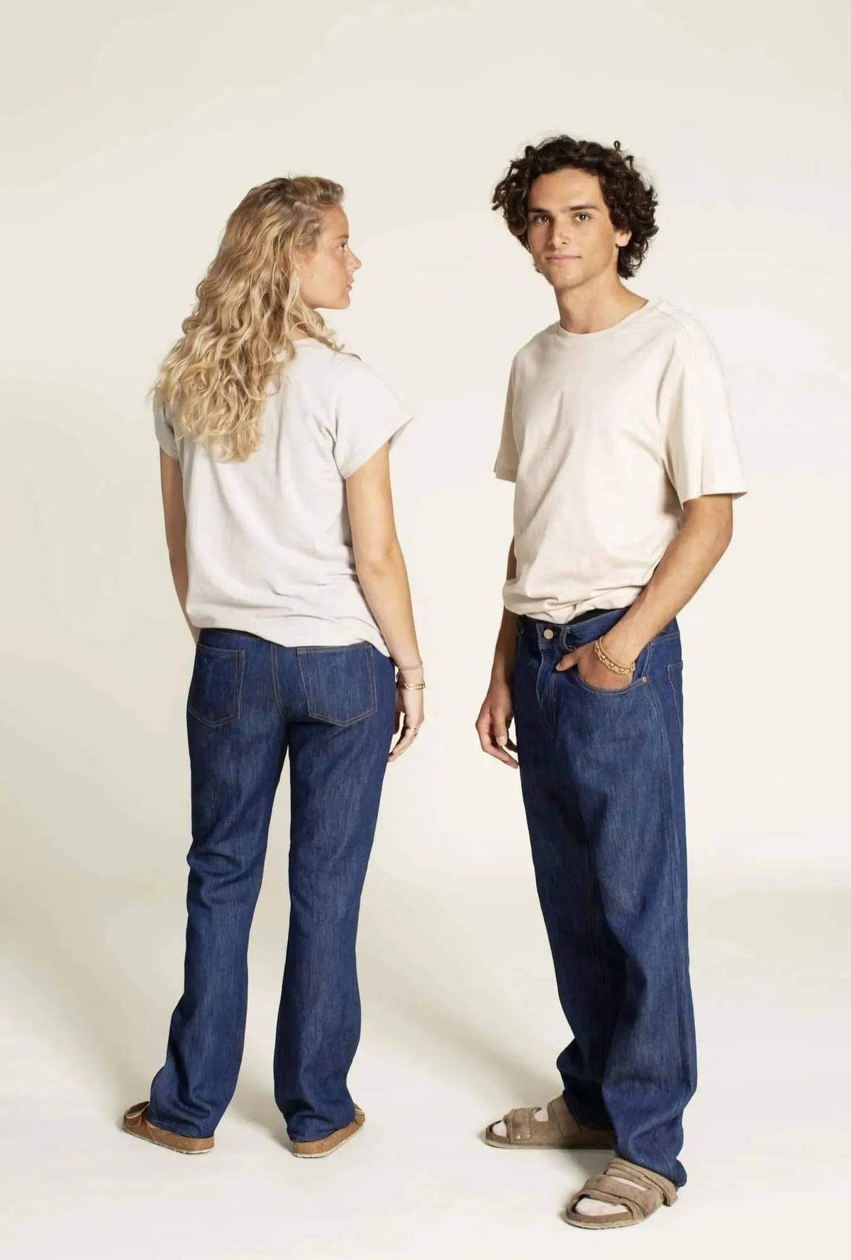 Men's Jeans Paper Pattern worn by models showcasing a casual style in blue jeans and neutral shirts.