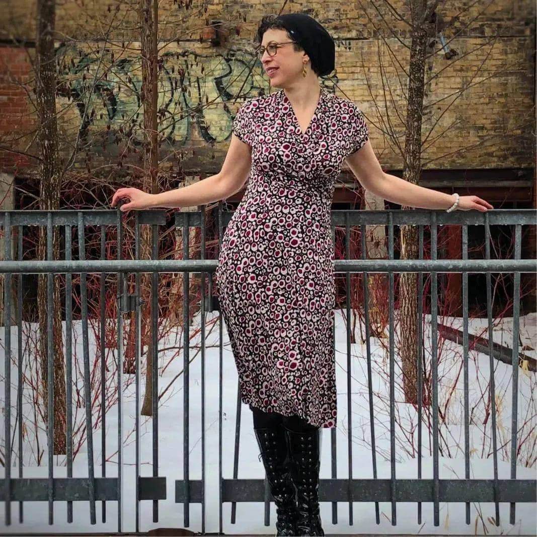 Mirri Dress Paper Pattern showcased on a model wearing a floral design dress with a shawl collar and fitted silhouette.