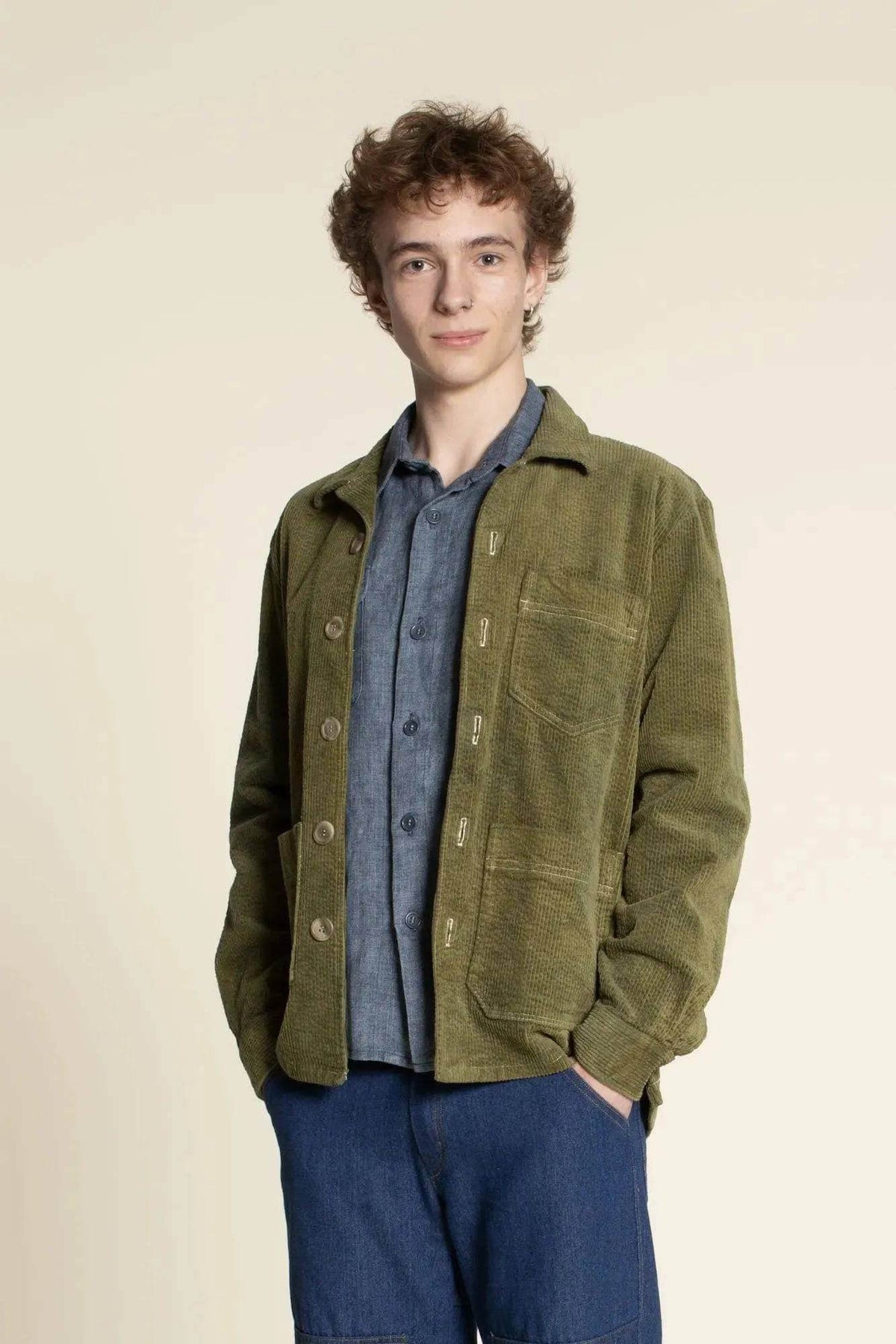 Overshirt Jacket Paper Pattern worn by a young man, showcasing a loose-fitting, long-sleeved design with patch pockets.