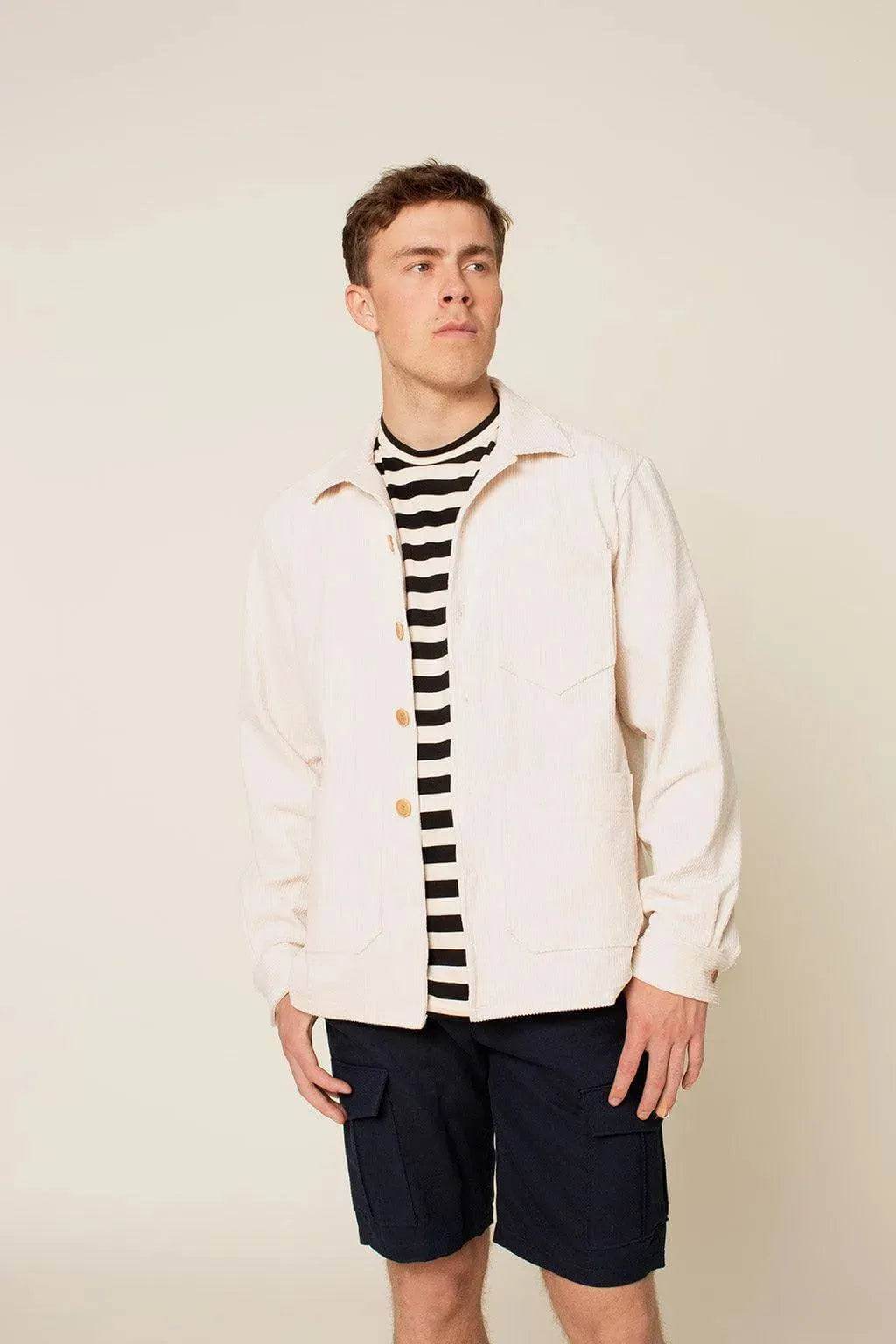Overshirt Jacket Paper Pattern worn by a man with striped shirt and shorts, showcasing a loose-fit design and patch pockets.