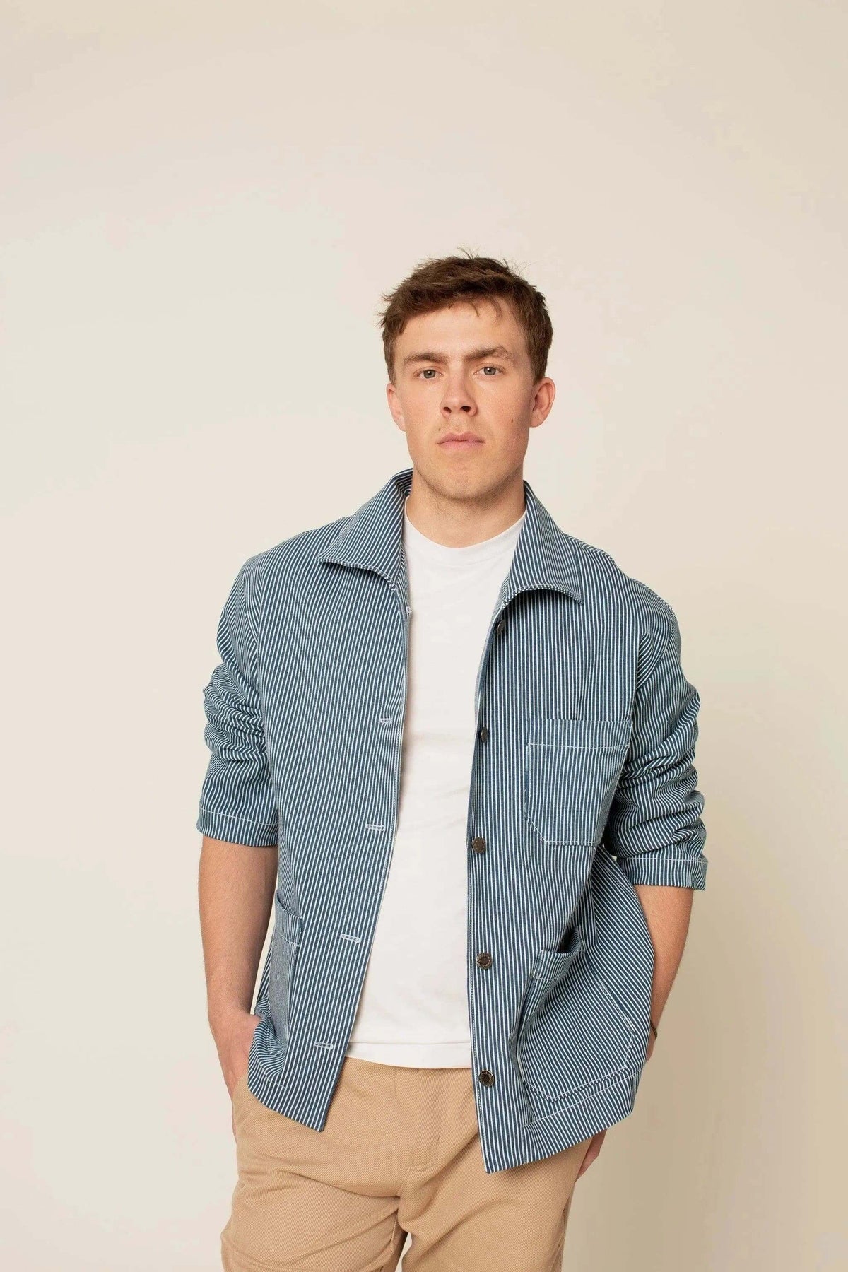 A model wearing the Painter jacket Paper Pattern in blue with oversized design and patch pockets.