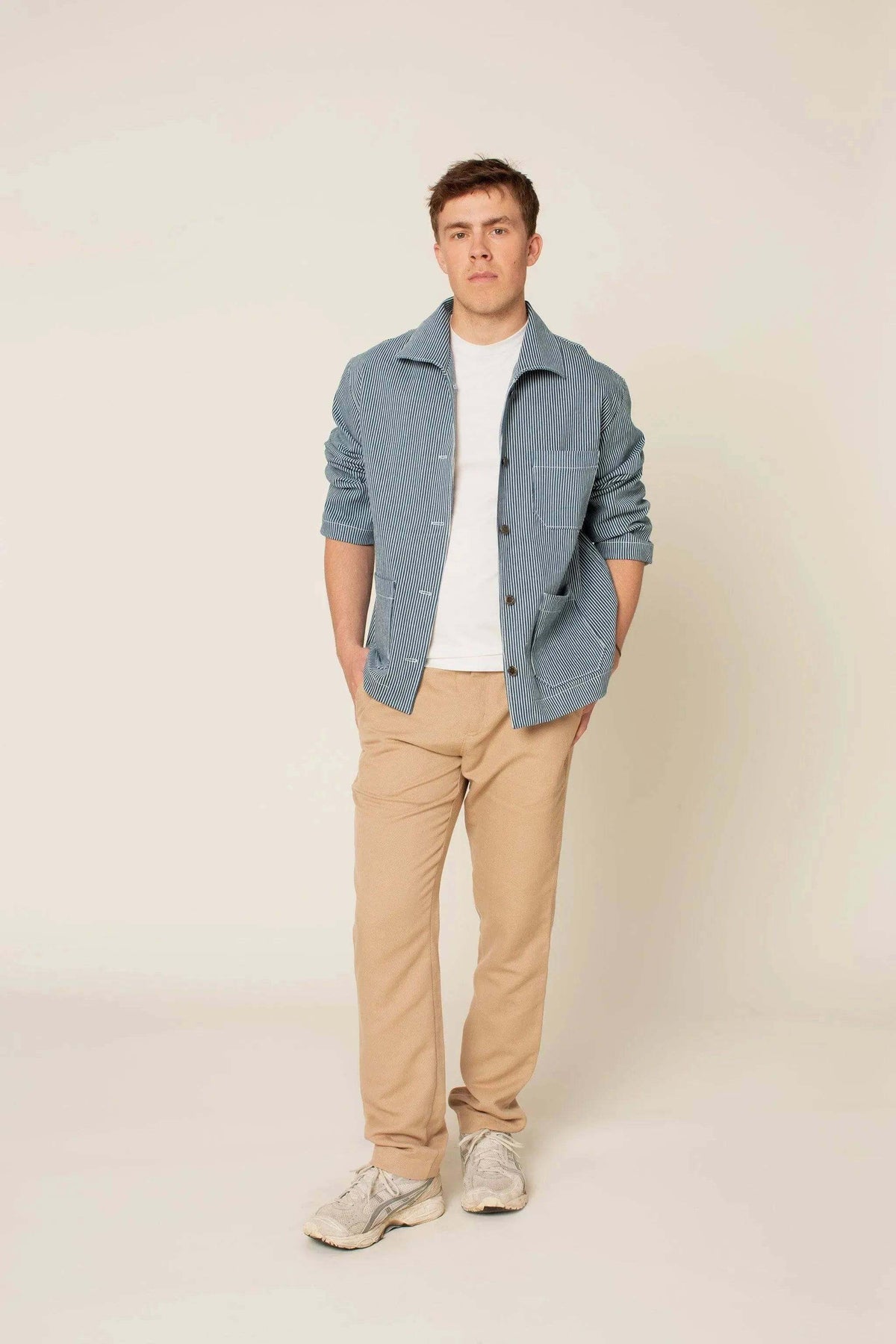 Model wearing a Painter jacket Paper Pattern with oversized fit and patch pockets, paired with beige pants.