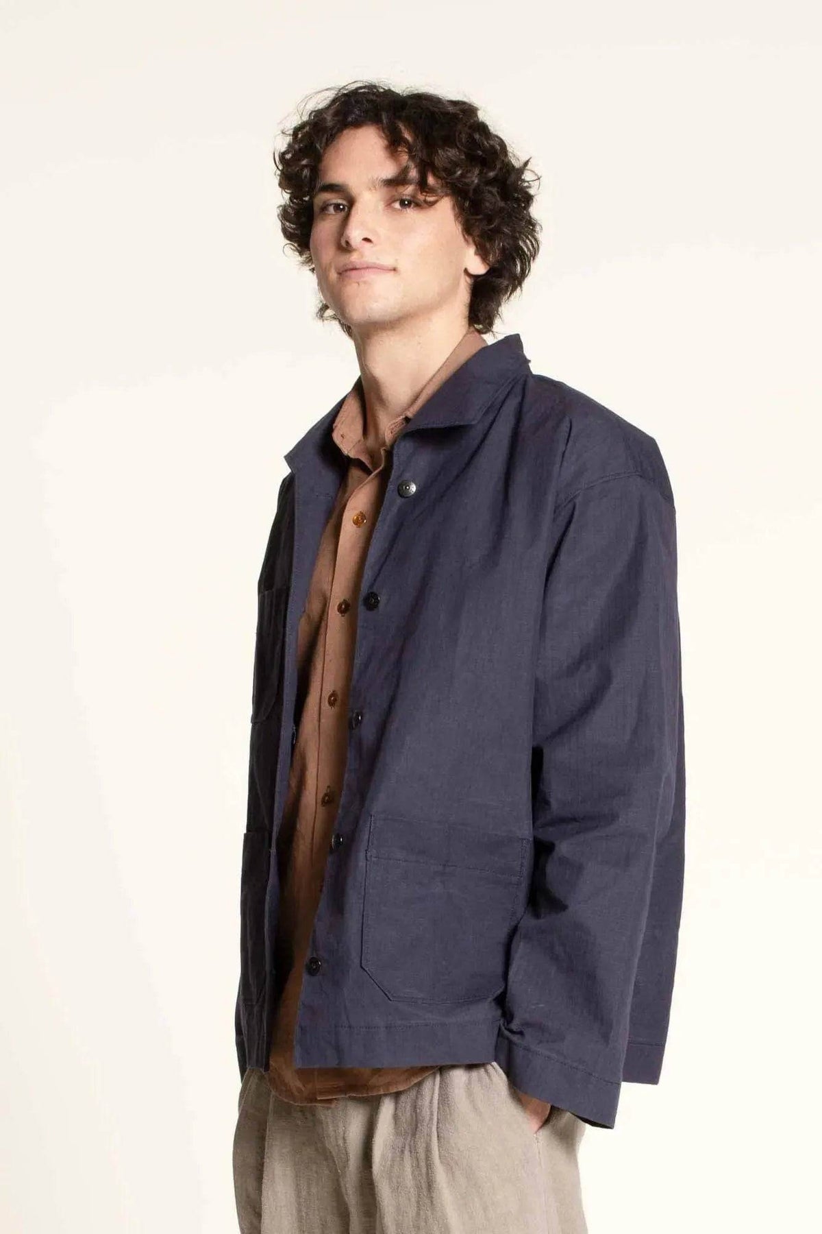Model wearing the Painter jacket Paper Pattern in navy with oversized fit and patch pockets.