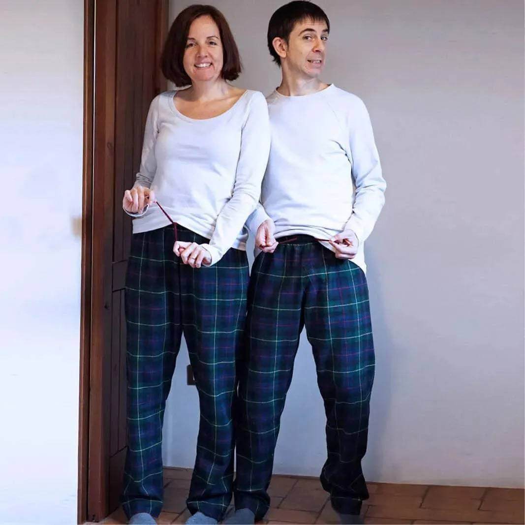 Two people wearing Pajama Pants Paper Pattern standing together in a cozy setting, showcasing relaxed style.