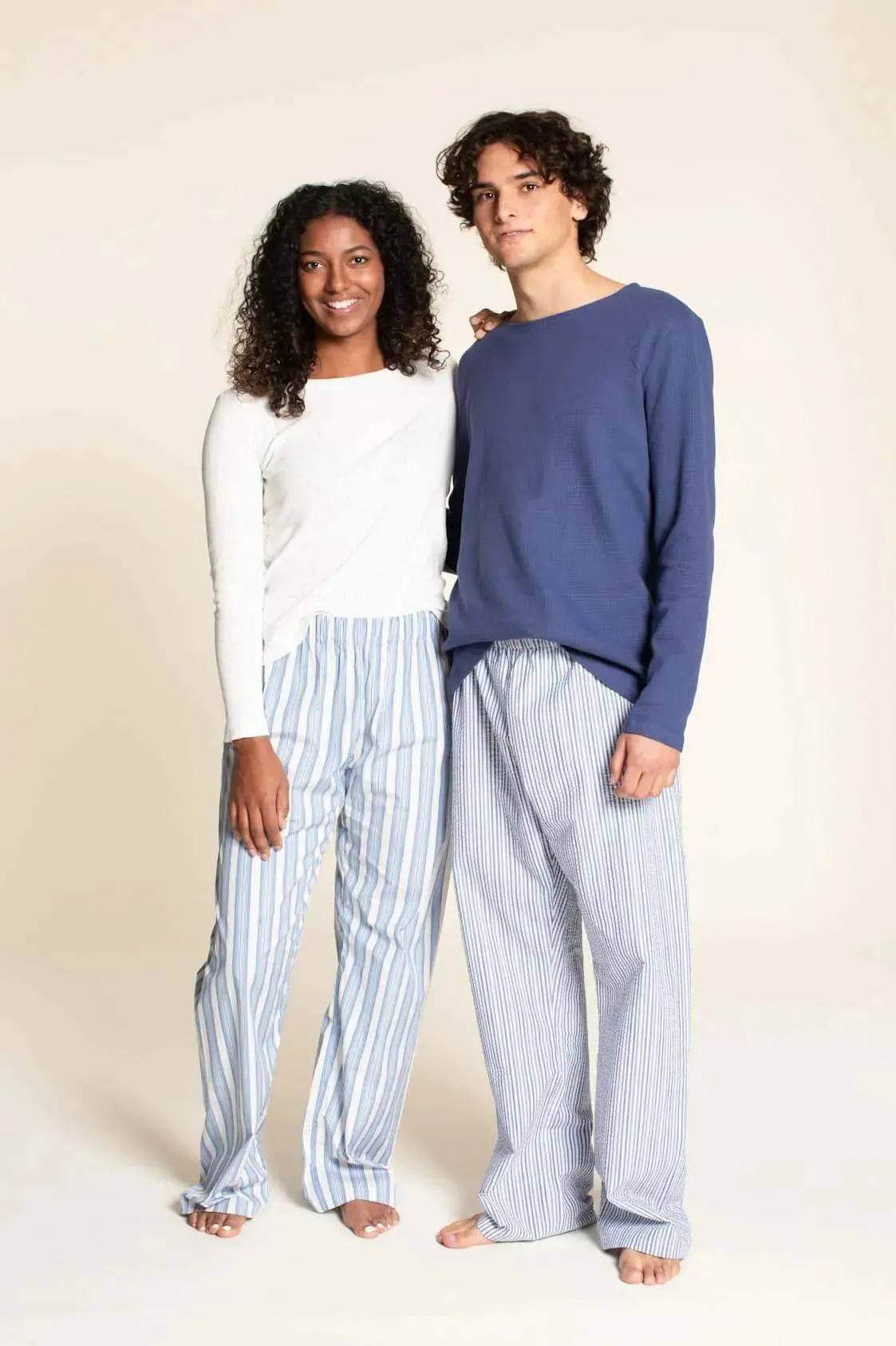 Pajama Pants Paper Pattern displayed on a unisex model duo wearing striped pajama pants and comfortable tops.