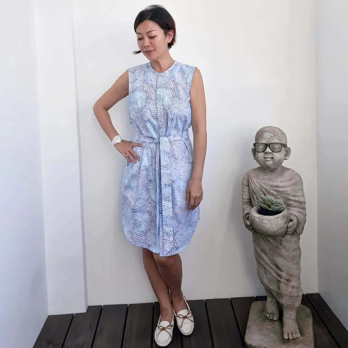 Woman wearing a stylish Savannah shirt Paper Pattern dress with a tie, showcasing modern elegance and versatility.