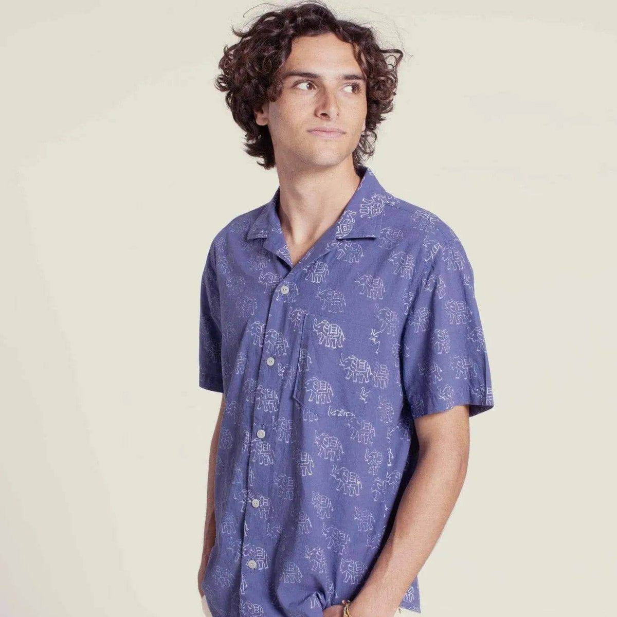 Tropical shirt paper pattern in blue with elephant print, featuring short sleeves and a relaxed fit for men.