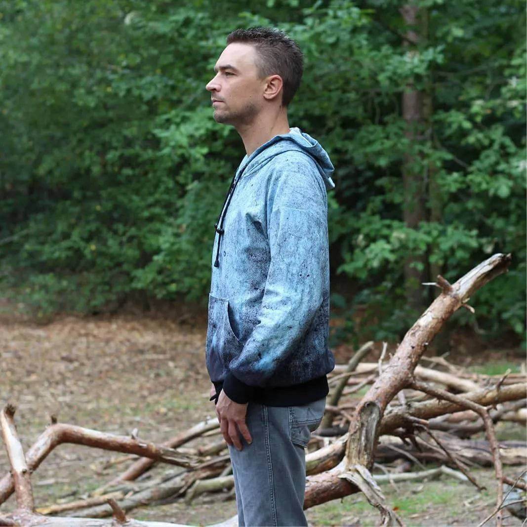 Zipper hoodie paper pattern modeled by a man outdoors, showcasing relaxed fit and stylish design.