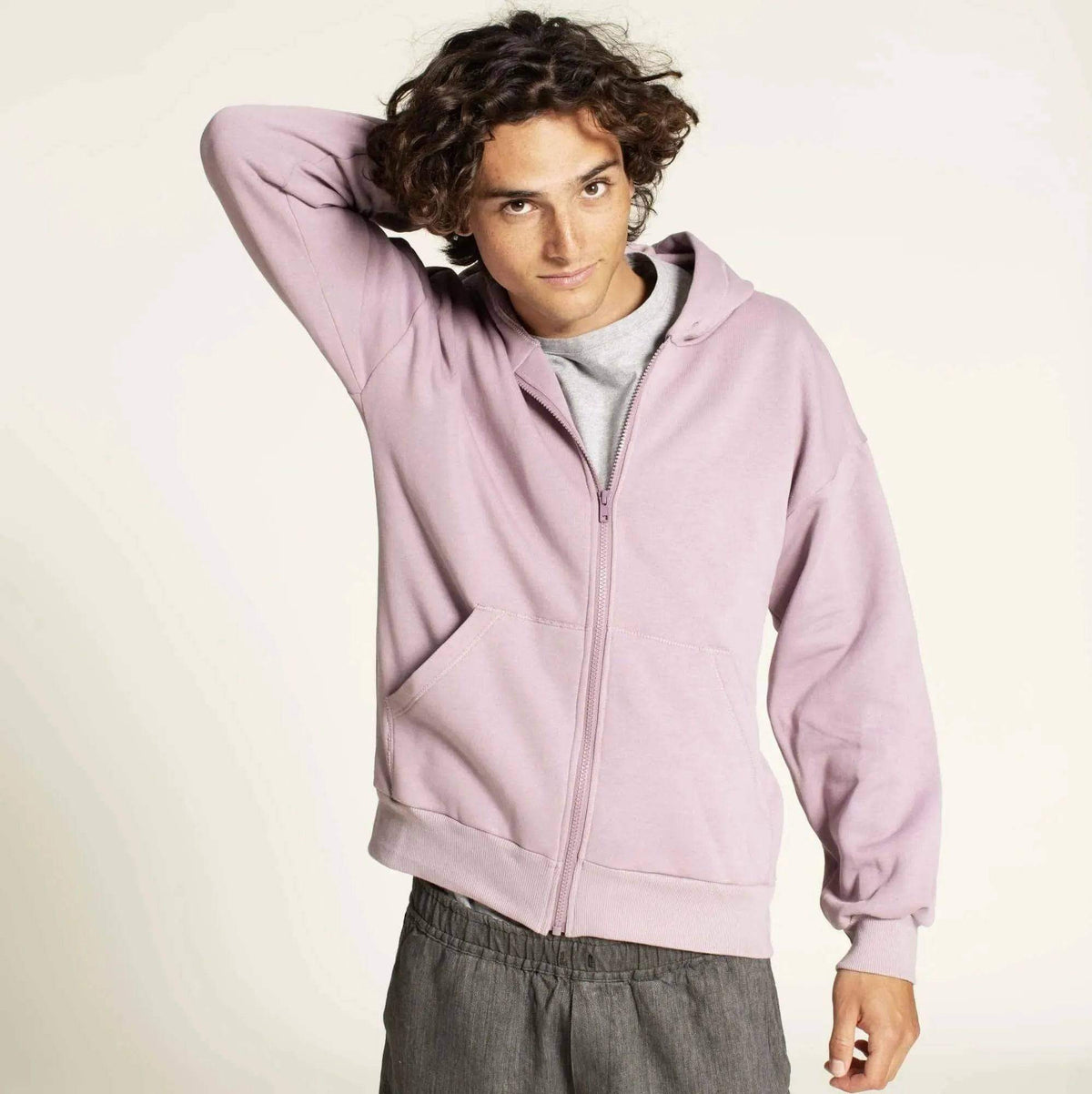 Zipper hoodie paper pattern in lavender on a model, showcasing relaxed fit and full-length zipper.