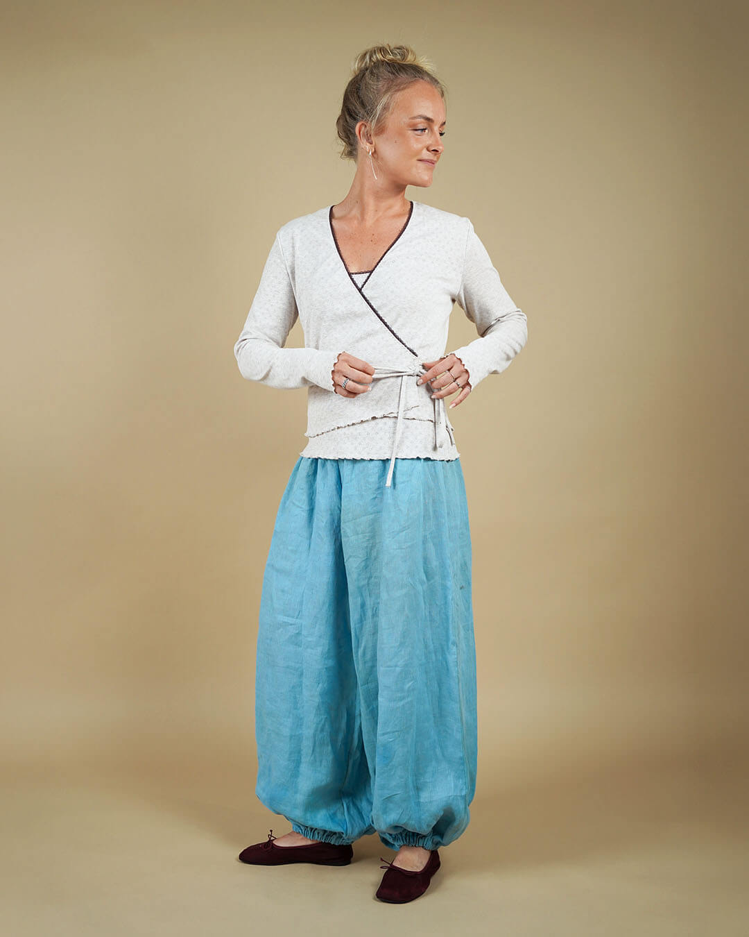 Woman wearing the Wrap Blouse and Bubble Pants sewing pattern, front view