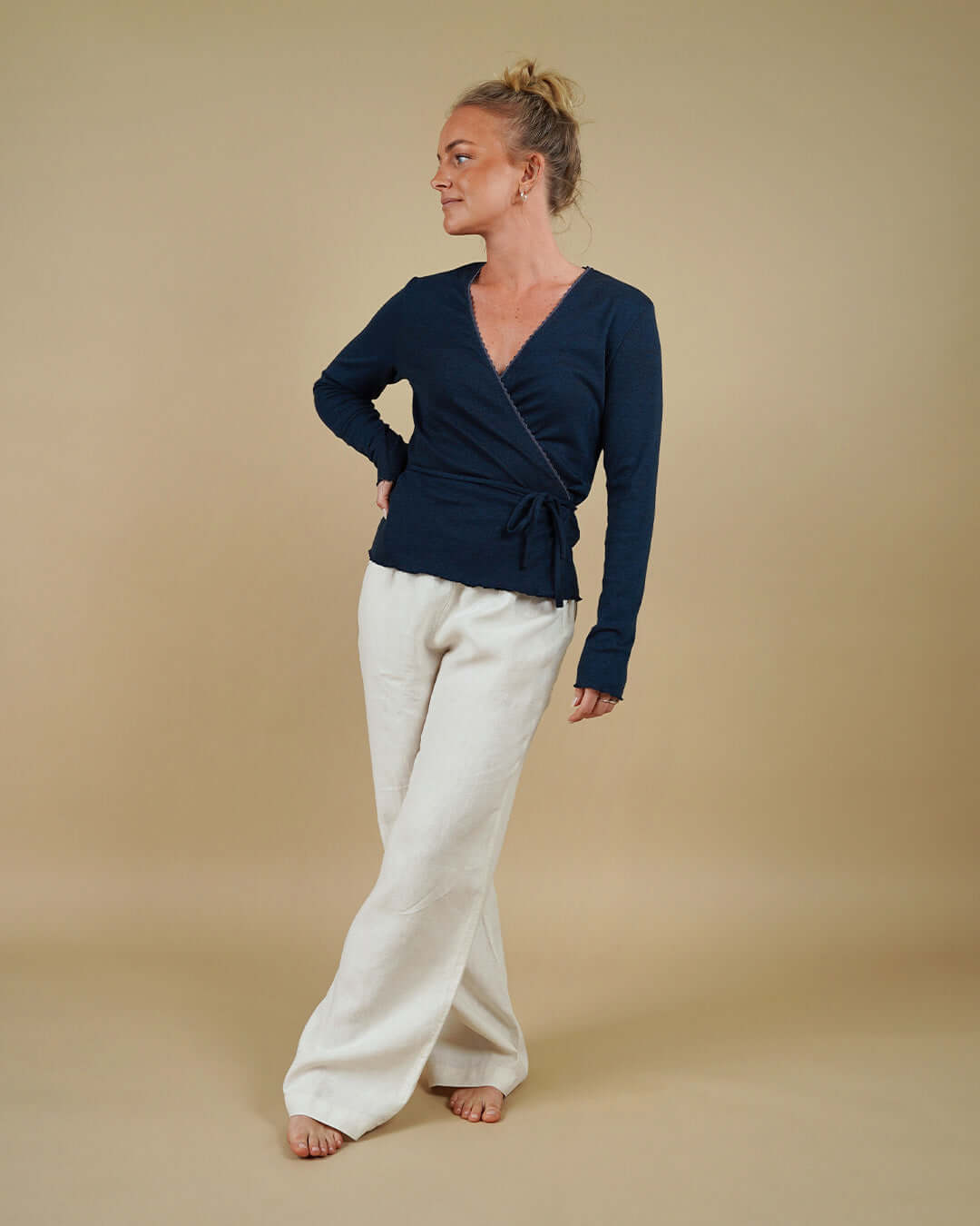 Woman wearing the Wrap Blouse and High Waist Pants sewing pattern, front view
