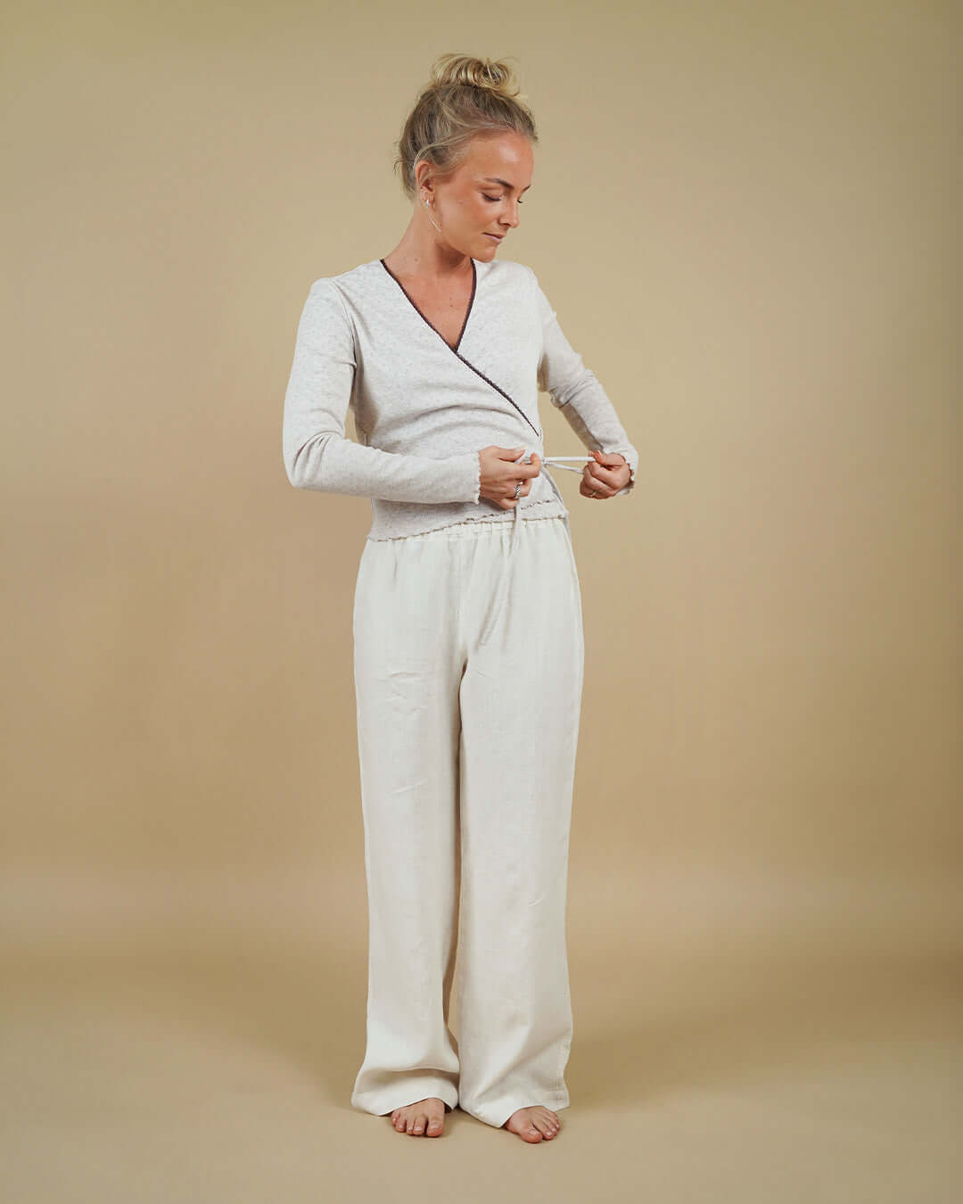 Woman wearing the Wrap Blouse and High Waist Pants sewing pattern, front view